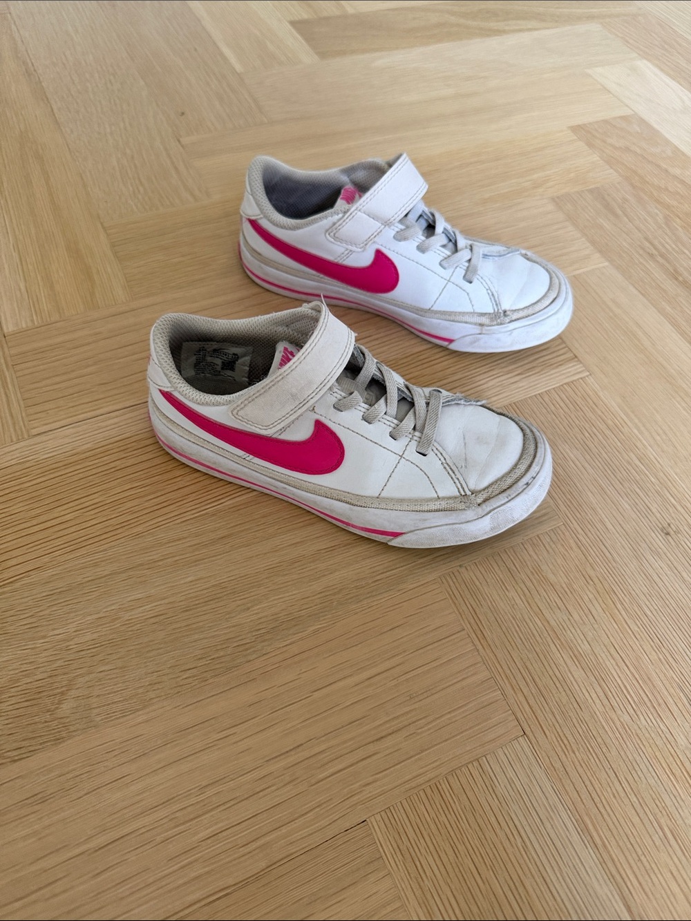 Nike Kids White Sneakers with Pink Swoosh Accent